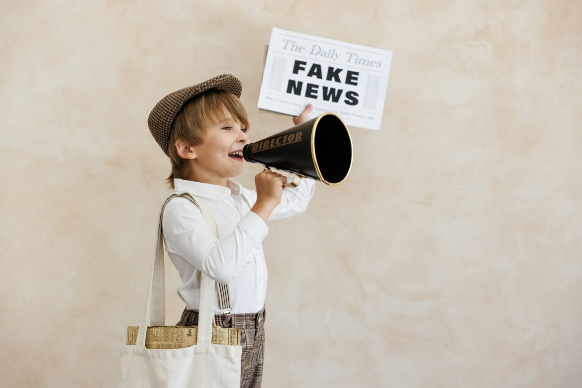 Newsboy shouting against grunge wall background. Boy selling fake news