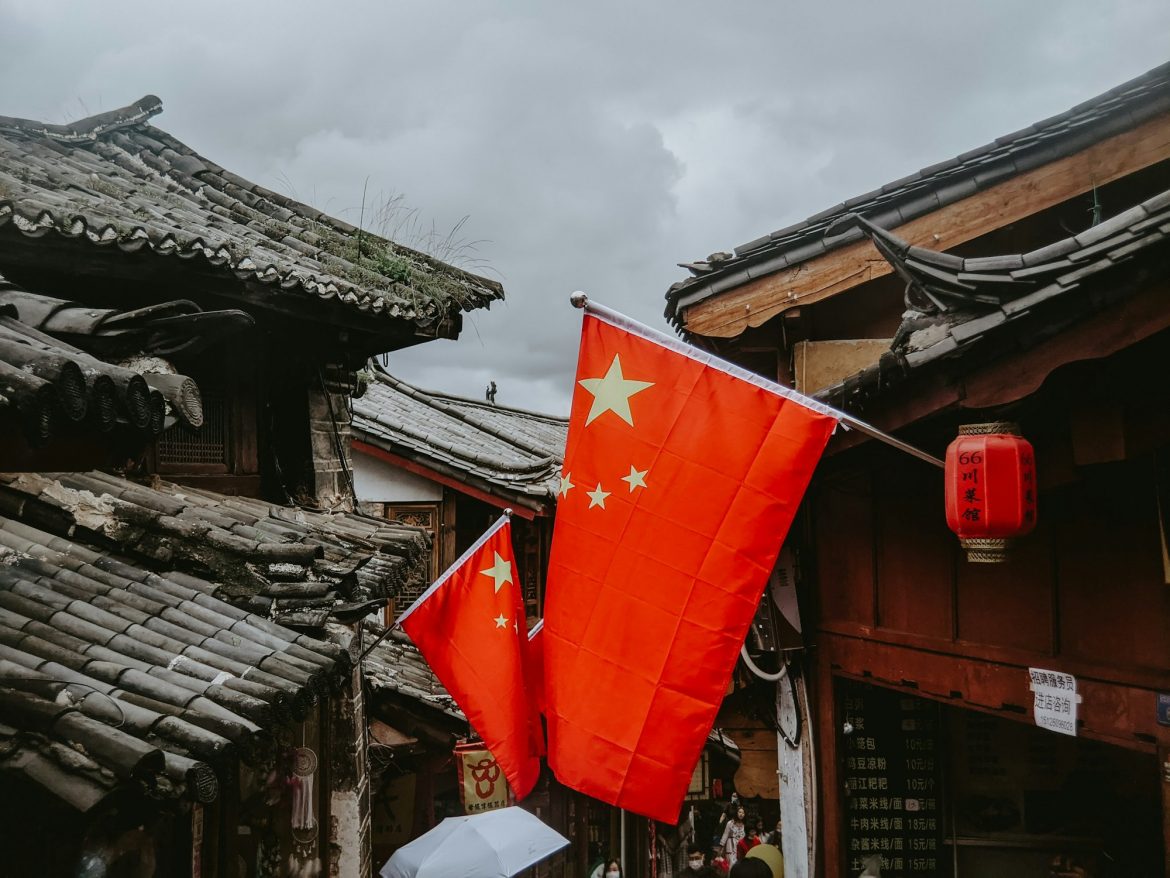 Closeup shot of Chinese flags on buildings Closeup shot of Chinese flags on buildings