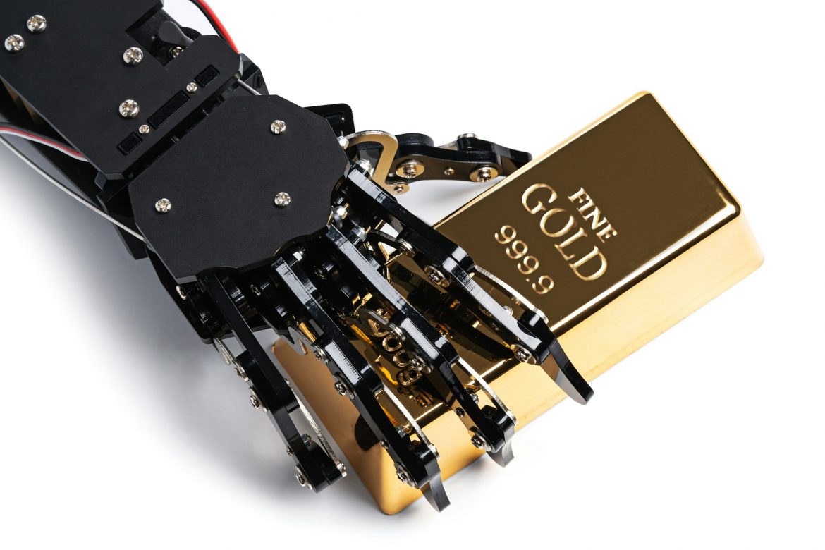 Real robotic hand with gold bullion bars
