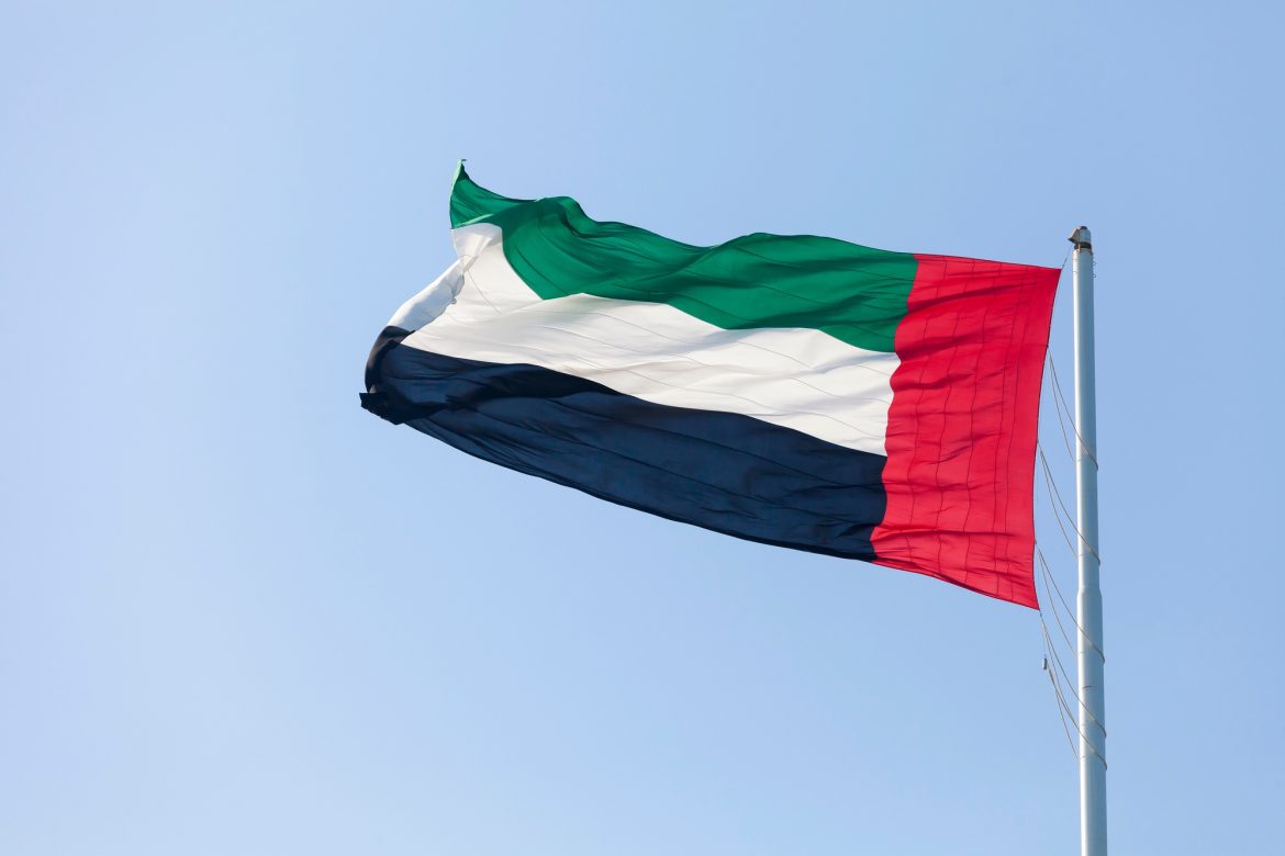 UAE flag against blue sky