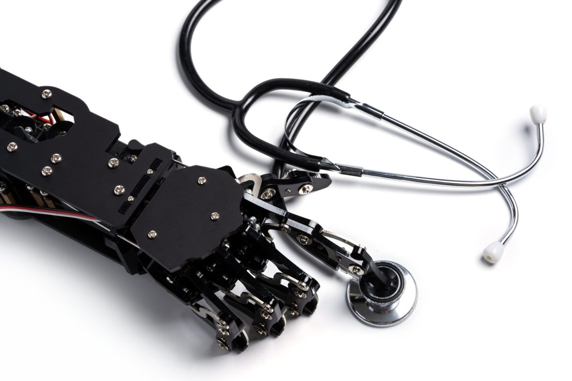 Real robotic hand with stethoscope. Concept of Artificial intelligence and robots in medicine