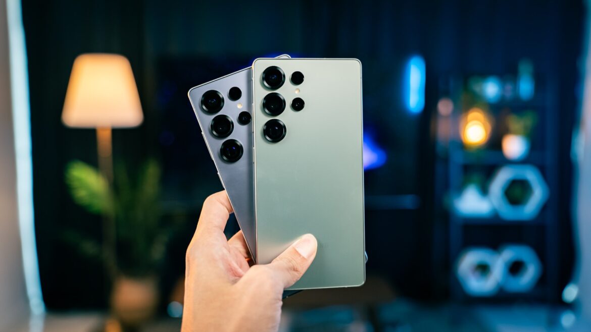 A person holding a remote control in their hand