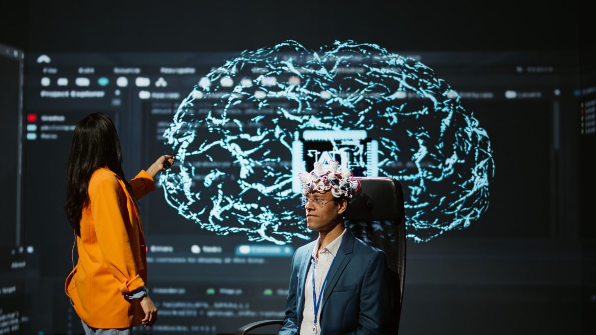 Neuroscientist does demonstration at AI forum in front of businessmen