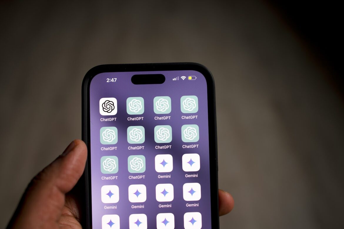 a person holding a cell phone in their hand