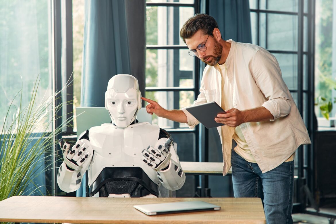 Robot and man at home Robot and man at home