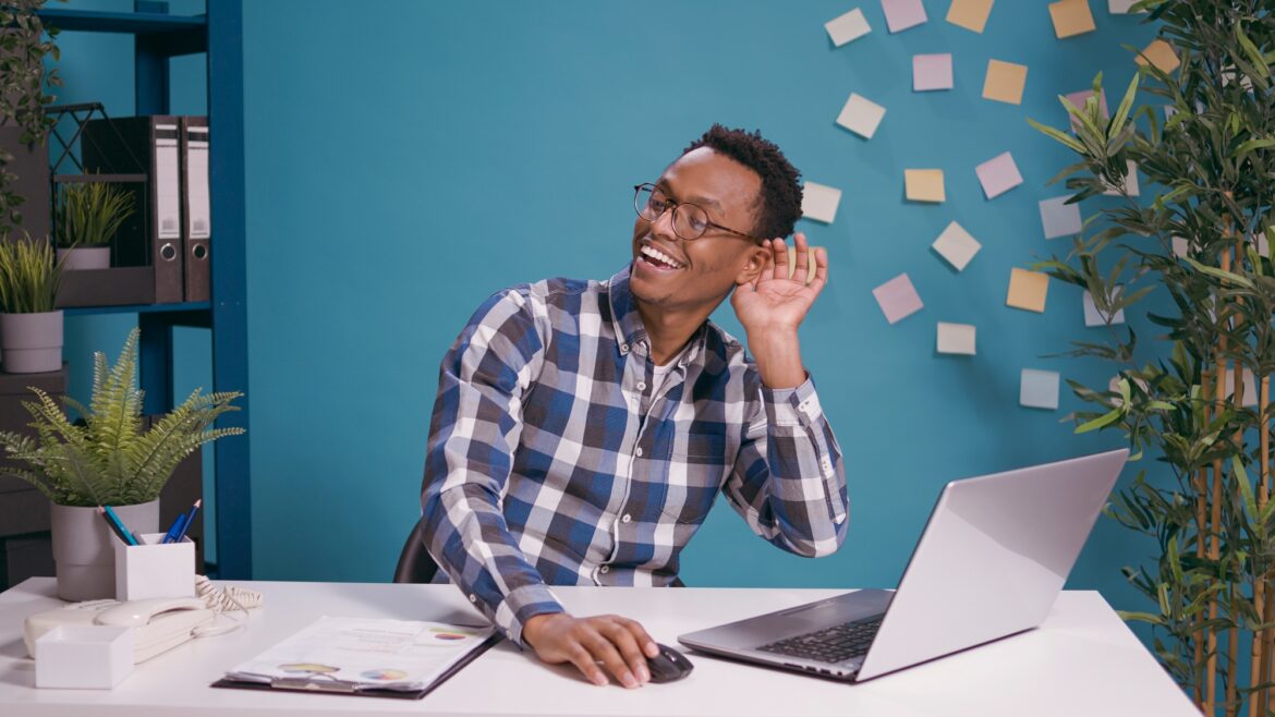 African american man listening to gossip and rumor at laptop