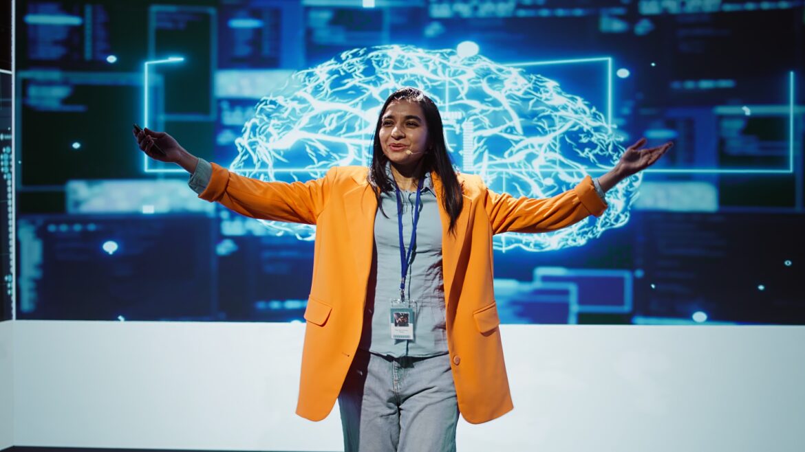 Expert showcasing latest innovations in AI, camera A تأثير الذكاء الاصطناعي على الأسواق الدولية ومنشآت الأعمال