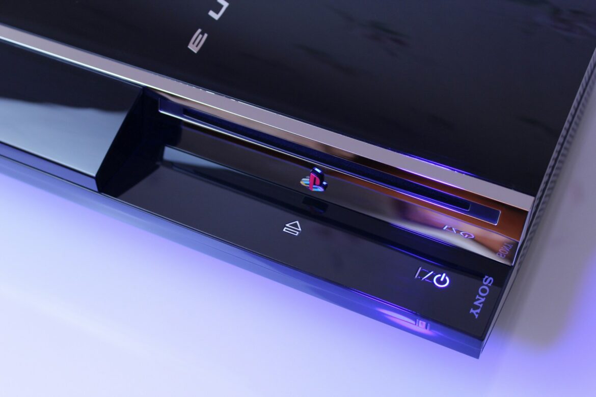 Photo by Nikita Kostrykin black Sony PS3 classic on top of white surface