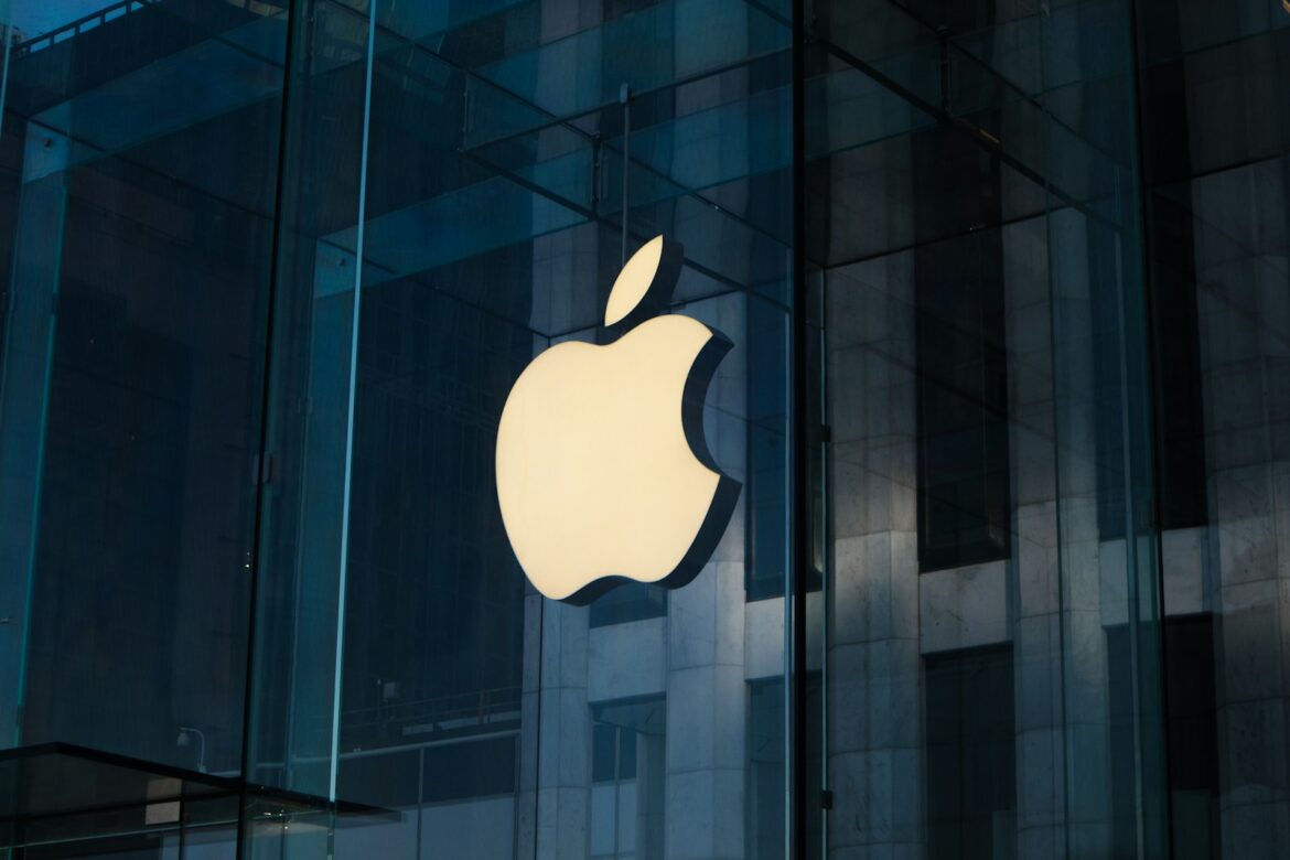 Photo by Laurenz Heymann apple logo on glass window