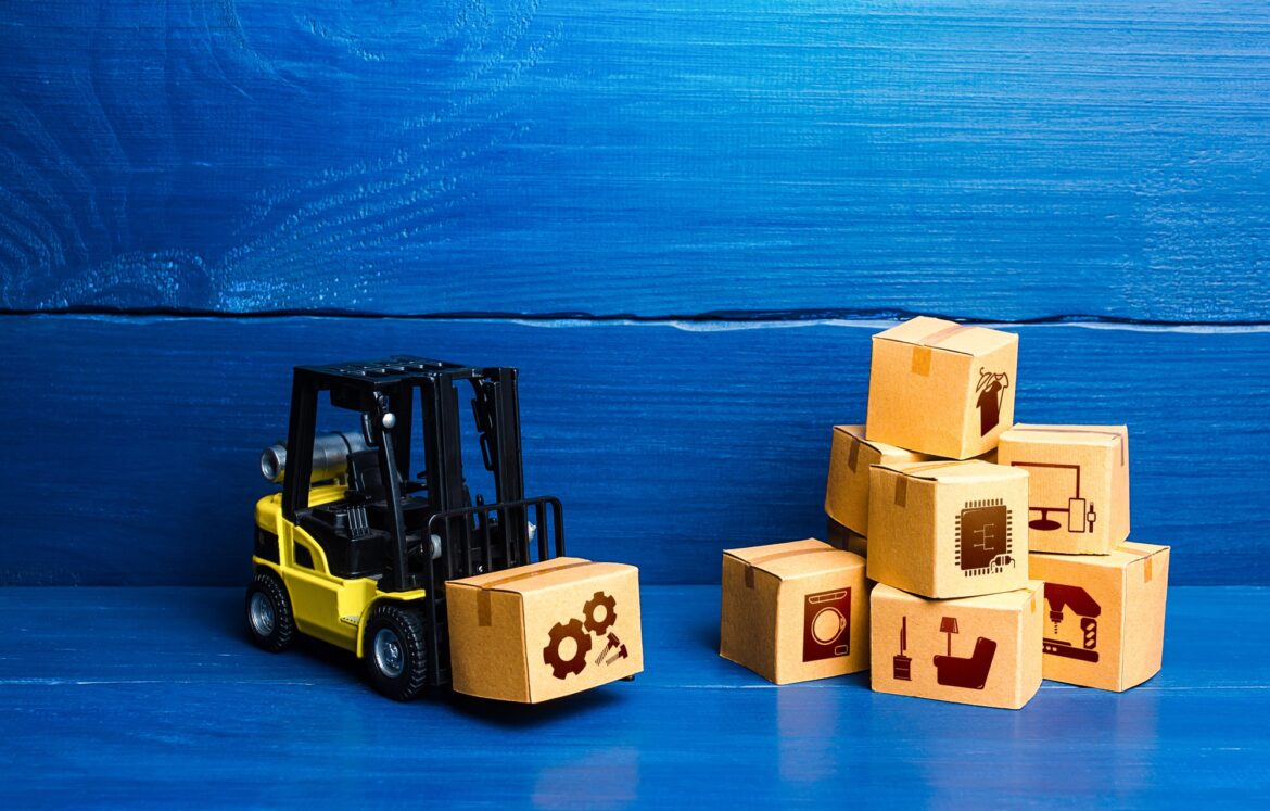 Forklift truck and cardboard boxes with goods. Logistic infrastructure and warehousing services