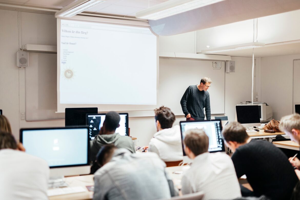 Media students and teacher in classroom