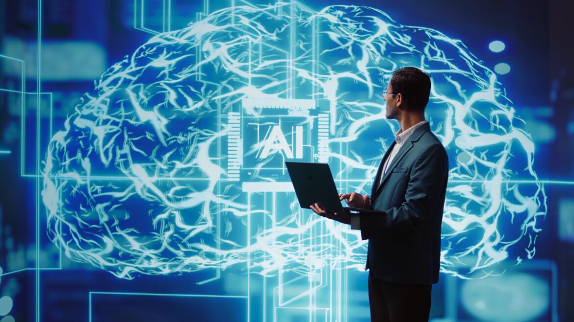 Man using notebook to write lines of code for AI applications Man using notebook to write lines of code for AI applications
