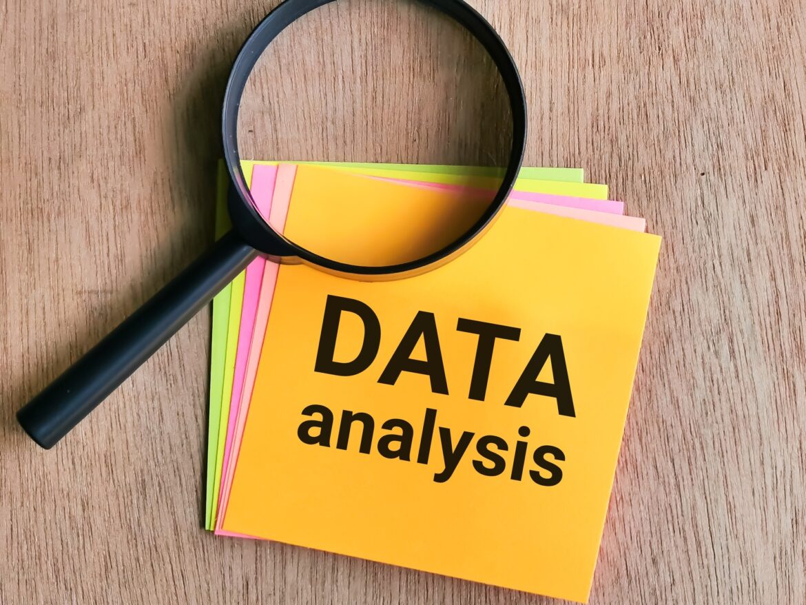 Phrase DATA ANALYSIS written on sticky note Phrase DATA ANALYSIS written on sticky note