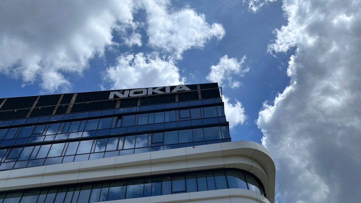 Photo by M. Rennim a building with a cloudy sky