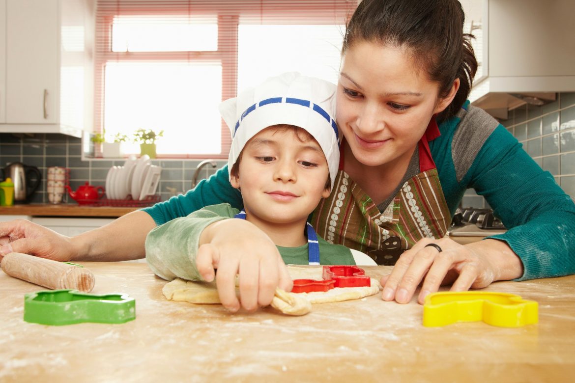 Mother and son cooking together