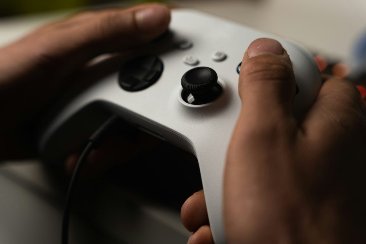 Closeup shot of a white XBOX controller in hands