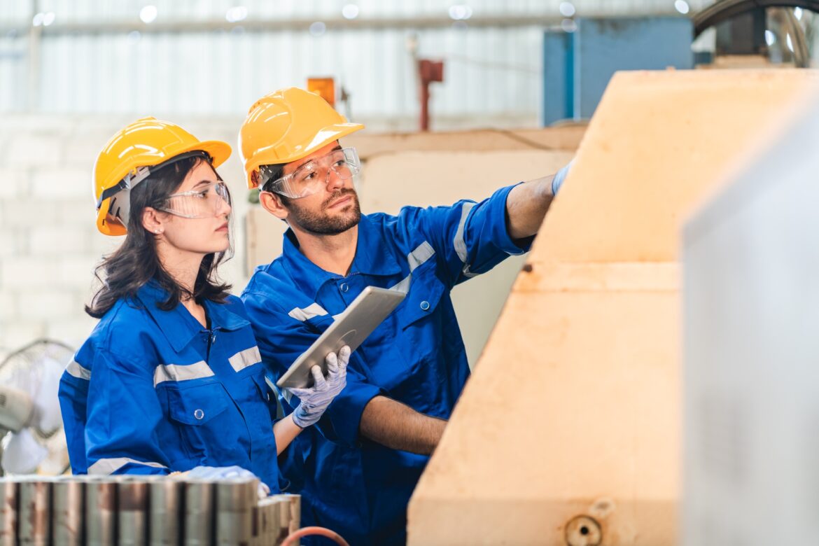 Artificial intelligence robotic technician concept, Factory engineer inspecting on machine