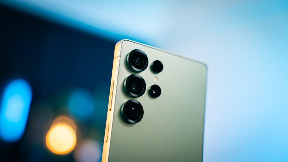 A close up of a cell phone with a blurry background