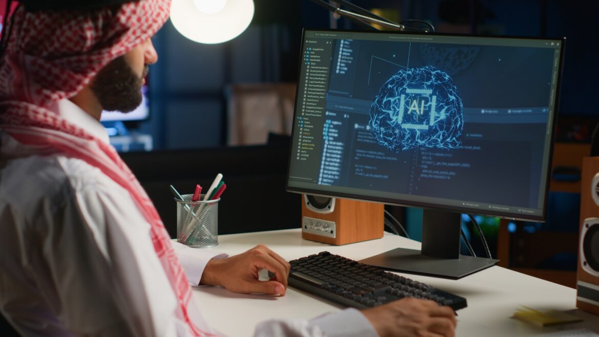 Man in personal office writes AI code