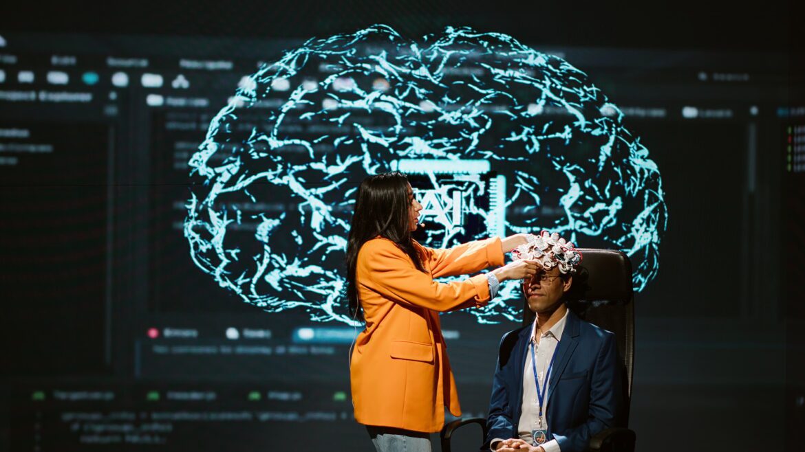Neuroscientist does demonstration at AI forum in front of businessmen